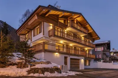 a large house with a balcony on top of it at Jacaranda1 Sublime 8pax 100m2 Vue MtBlanc Central Parking in Chamonix-Mont-Blanc