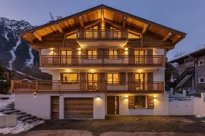 a large house with a wooden roof at Jacaranda3 Sublime 6pax Vue MtBlanc Central Parking in Chamonix-Mont-Blanc