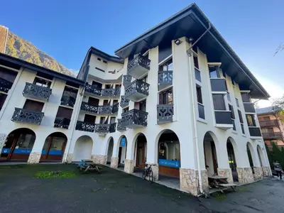 a large white building with balconies on it at Studio Le Triolet-6 by Interhome in Chamonix-Mont-Blanc
