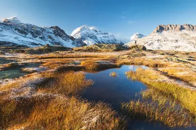a small pond in the middle of a snowy mountain at Apartment Majestic 1 - Central Chamonix Haven Mont Blanc in Chamonix-Mont-Blanc
