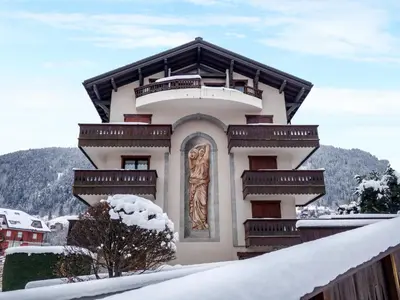 a view from a balcony of a town with mountains at Apartment Jardins Alpins 5 by Interhome in Saint-Gervais-les-Bains