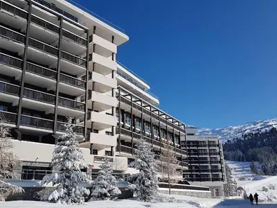 a building with snow covered trees in front of it at Appartement lumineux 4 pièces à Flaine, 8 personnes, terrasse, accès spa - FR-1-425-18 in Flaine