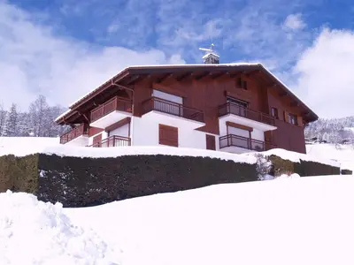 a large building in the snow with snow around it at Appartement 3 pièces Megève - Animaux admis, Parking inclus - FR-1-453-38 in Megève