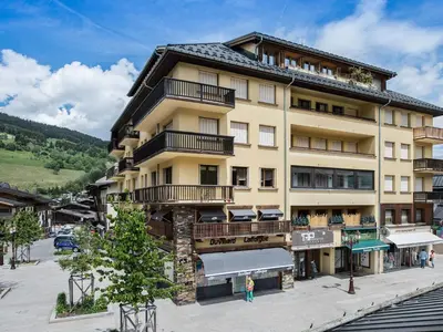 a large building with balconies on the side of it at Appartement central 2 chambres avec balcon et Wifi à Megève - FR-1-453-53 in Megève