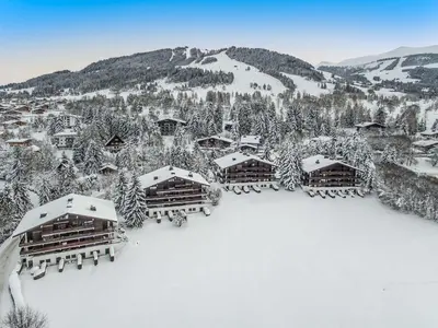 an aerial view of a resort in the snow at Appartement spacieux 1 chambre à Megève, balcon, parking inclus - FR-1-453-62 in Megève