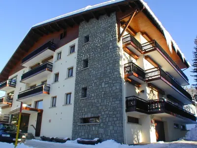 a building with balconies on the side of it at Appartement rénové 2 chambres à Megève Centre avec balcon - FR-1-453-66 in Megève