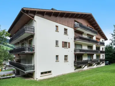 a building with balconies on the side of it at Appartement 2 pièces au cœur de Megève avec balcon et parking - FR-1-453-118 in Megève
