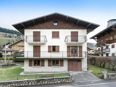 a building with balconies on the side of it at Appartement 2 pièces avec balcon et parking à Megève - FR-1-453-120 in Megève