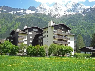 a large building in front of a mountain at Apartment Clos du Savoy-8 by Interhome in Chamonix-Mont-Blanc