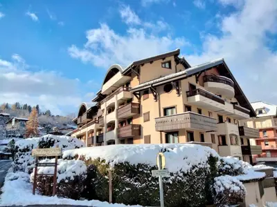 a building with snow on the ground in front of it at Apartment Jardins Alpins 1 by Interhome in Saint-Gervais-les-Bains