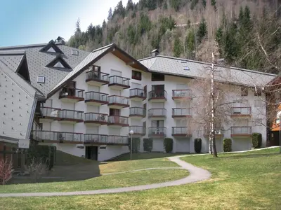 a view of a mountain with trees and a building at Apartment La Borgia A- B- C-1 by Interhome in Les Contamines-Montjoie