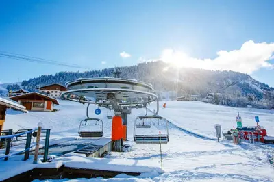 a ski lift in the snow with the sun in the background at Fabulous Residence Lesporting Ski - AE203 in Megève
