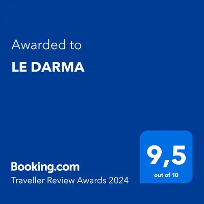 a blue sign with the text awarded to le danamine at LE DARMA in Sixt