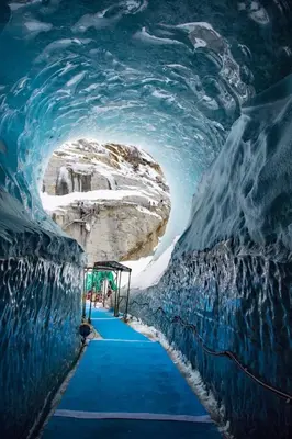a blue carpeted tunnel in an ice cave at Apartment Grepon 3A - A Central Chamonix Haven in Chamonix-Mont-Blanc