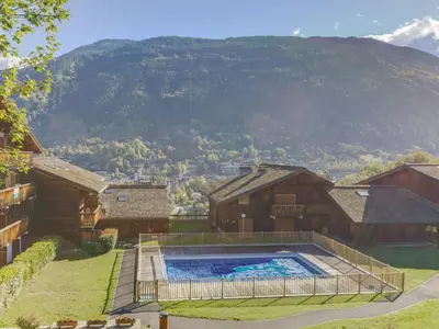 a large wooden building with two decks on it at Apartment Les G'rets-7 by Interhome in Saint-Gervais-les-Bains