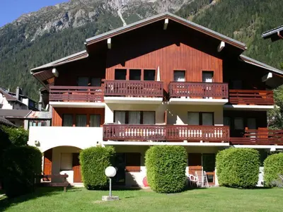 a large apartment building with a large balcony at Studio cosy à Chamonix - Animaux admis, parking privé - FR-1-517-21 in Chamonix-Mont-Blanc
