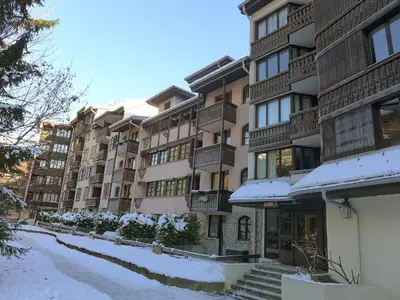 a snow covered street in front of a building at Apartment Jonquilles-10 by Interhome in Chamonix-Mont-Blanc