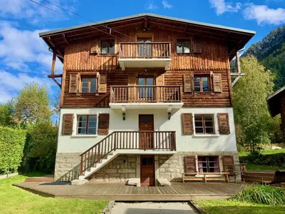 a large wooden house with balconies on the side of it at The Castle, 10 Bedroom Chalet, Chamonix Centre in Chamonix-Mont-Blanc