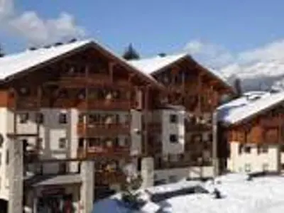 a group of buildings with snow on the roofs at Charmant Duplex 3 Chambres à 100m des Pistes, Parking, WIFI - FR-1-815-73 in Morillon