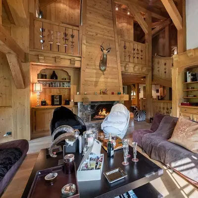 a living room with a couch and a fireplace at Beautiful Nirvana in Megève