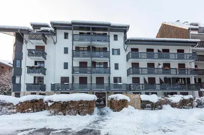 a building with snow in front of it at Appartement Cham-Vue in Chamonix-Mont-Blanc