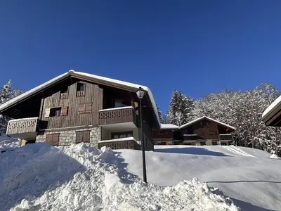 a house in the snow with a pile of snow at 3 pièces cabine avec parking, près des pistes et commerces - FR-1-572-55 in Les Carroz d'Araches