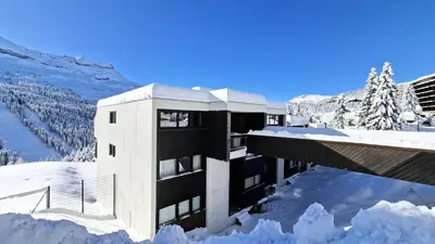 a building in the snow with snow around it at Résidence Belier - Appartement confortable · Au pied des pistes · WIFI gratuit et illimité · Terrasse MAE-7374 in Flaine