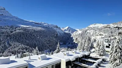 a view of a resort with snow covered trees and mountains at Résidence Les Terrasses De Veret - Appartement confortable · Au pied des pistes · Piscine · Spa · Parking inclus MAE-7391 in Flaine