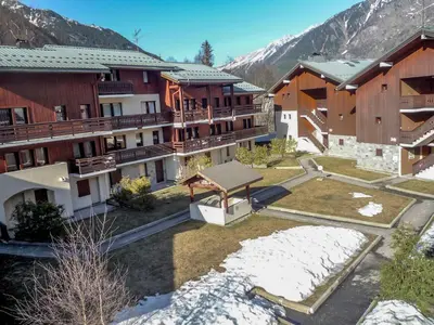 a group of buildings with snow on the ground at Studio Les Jardins du Mont-Blanc-4 by Interhome in Chamonix-Mont-Blanc