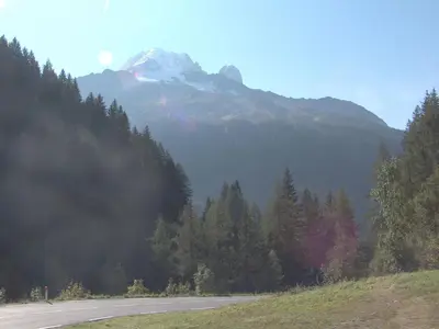 a road in the mountains with a snow covered mountain at Studio Lognan-1 by Interhome in Chamonix-Mont-Blanc