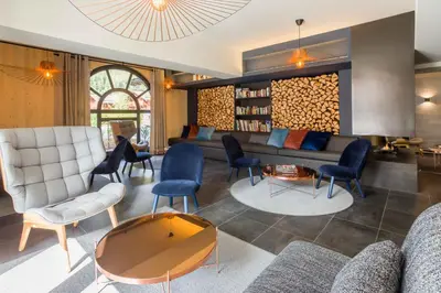 a living room with a couch and chairs at La Cordee 124 Apartment - Chamonix All Year in Chamonix-Mont-Blanc