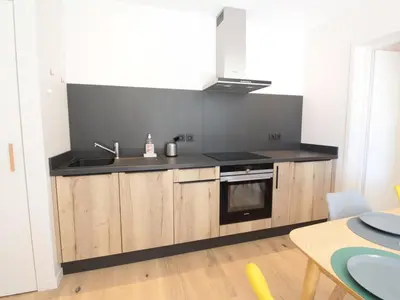 a kitchen with a sink and a stove at Appartement ski aux pieds, 3 pièces, 6 pers, terrasse sud, près des Carroz - FR-1-572-248 in Les Carroz d'Araches