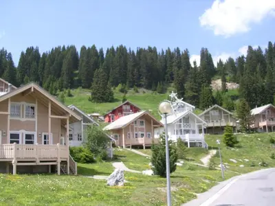 a row of houses on a hill with a street light at Chalet spacieux avec poêle à bois, WIFI gratuit, terrasse, garage et proche des pistes - FR-1-425-122 in Flaine