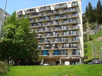a large building with balconies on the side of it at Studio lumineux proche des pistes avec balcon - FR-1-425-169 in Arâches-la-Frasse