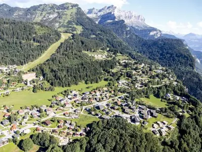 an aerial view of a village in the mountains at Studio 4 pers avec balcon, près des remontées mécaniques - FR-1-572-149 in Arâches-la-Frasse