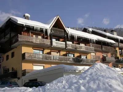 a building with a pile of snow in front of it at Studio 4 pers avec balcon, près des remontées mécaniques - FR-1-572-149 in Arâches-la-Frasse