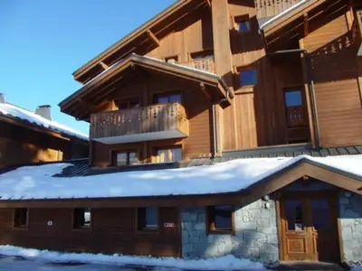 a large house with snow on the roof at 3 pièces, 6 pers, animaux admis, parking, vue sur piscine - FR-1-572-5 in Arâches-la-Frasse