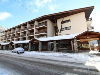 a building with a car parked in front of it at Studio 4 pers, cabine, Les Carroz, proche pistes - FR-1-572-95 in Arâches-la-Frasse