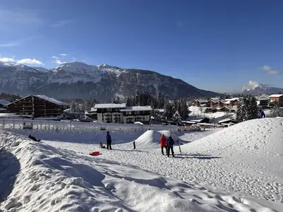 a group of people standing on a snow covered slope at Studio spacieux 4 pers, lit double, pistes, parking - FR-1-572-146 in Arâches-la-Frasse