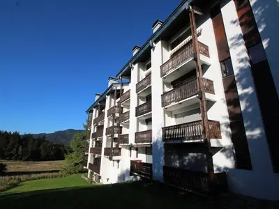 an apartment building with balconies on the side of it at Studio chaleureux, balcon sud, 4 pers., proche centre et pistes - Les Carroz - FR-1-572-218 in Arâches-la-Frasse