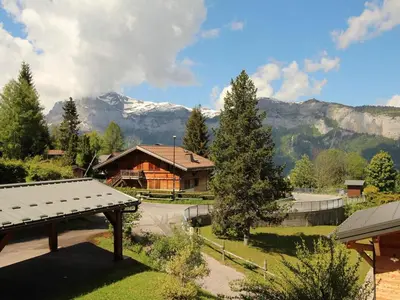 a house with a view of a mountain at Studio 4 pers, rénove, lave-vaisselle, parking, pied des pistes - FR-1-572-197 in Arâches-la-Frasse