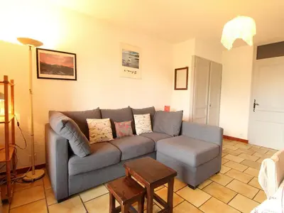 a living room with a couch and a table at Studio 4 pers, rénove, lave-vaisselle, parking, pied des pistes - FR-1-572-197 in Arâches-la-Frasse