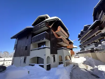 a building in the snow with snow around it at Appartement rénové 2P 4 pers, proche pistes et commerces - FR-1-572-20 in Arâches-la-Frasse