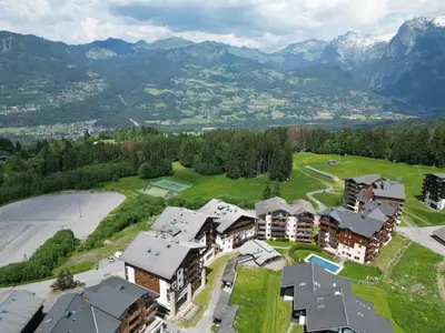 a tall building on the side of a road at Bel appartement familial aux pieds des pistes - FR-1-642-73 in Morillon