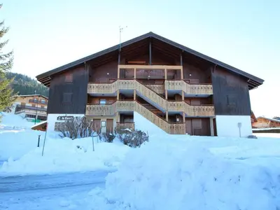 a large building with snow in front of it at Appartement Mansardé 3 Pièces, 6 Pers, Balcon Sud-Est, Garage, Proche Centre et Pistes - FR-1-572-147 in Arâches-la-Frasse