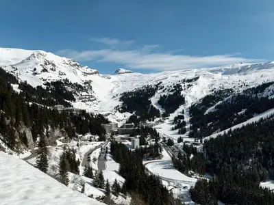 a snow covered mountain with trees and a ski slope at Studio rénové à Flaine Forêt, résidence Sirius, à 500m des pistes – 5 couchages - FR-1-687-17 in Arâches-la-Frasse