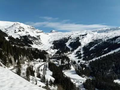 a snow covered mountain with trees and a ski slope at Studio en front de neige à Flaine, idéal pour skieurs, 4 pers, animaux admis - FR-1-687-58 in Arâches-la-Frasse