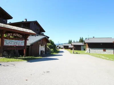 an empty road in front of a building at 4 pièces 6 pers : proche spa, ski bus, parking, WIFI - FR-1-572-119 in Arâches-la-Frasse