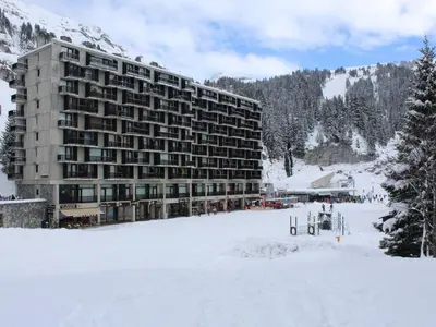 a large building in the snow with a snow covered field at Studio cosy Flaine Forum, balcon sud, à deux pas des pistes, idéal 3 pers. - FR-1-687-114 in Arâches-la-Frasse
